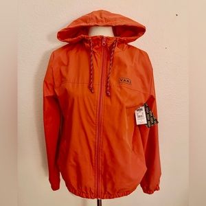 The Vans Jacket is a water resistan zip up  coaches jacket with a hood.